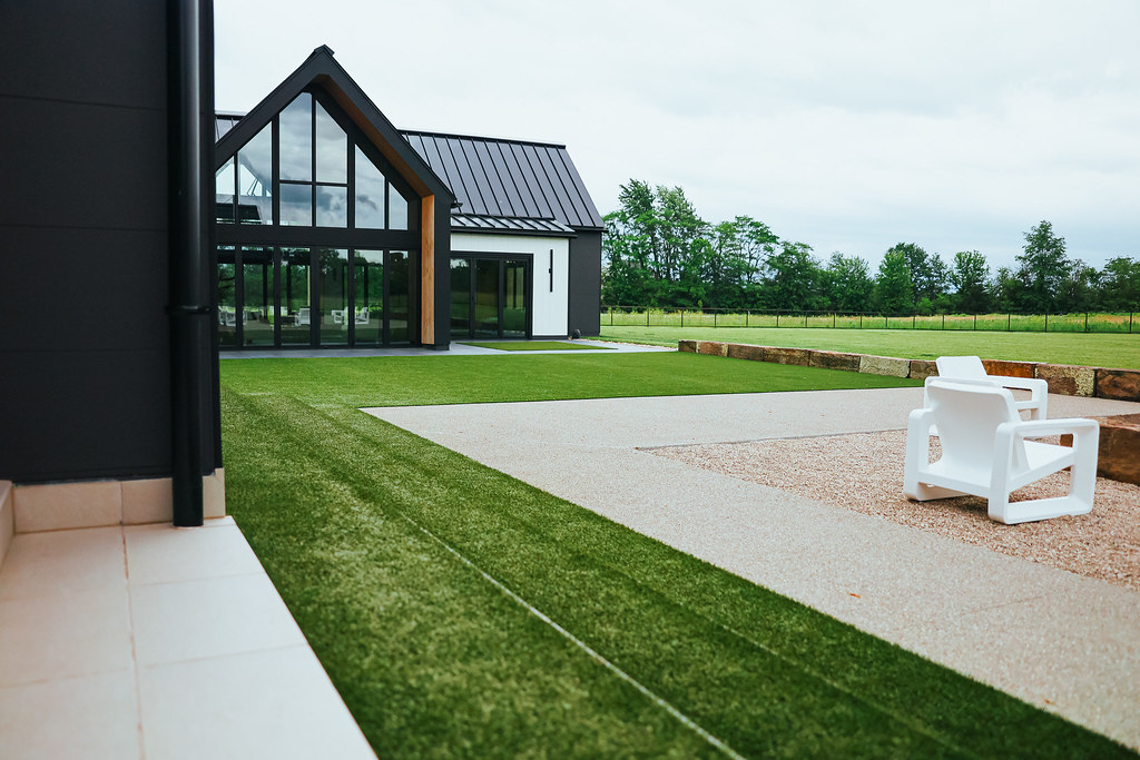 Beautiful modern home with artificial turf installation